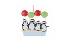 Family Of 4 Penguins On Ice